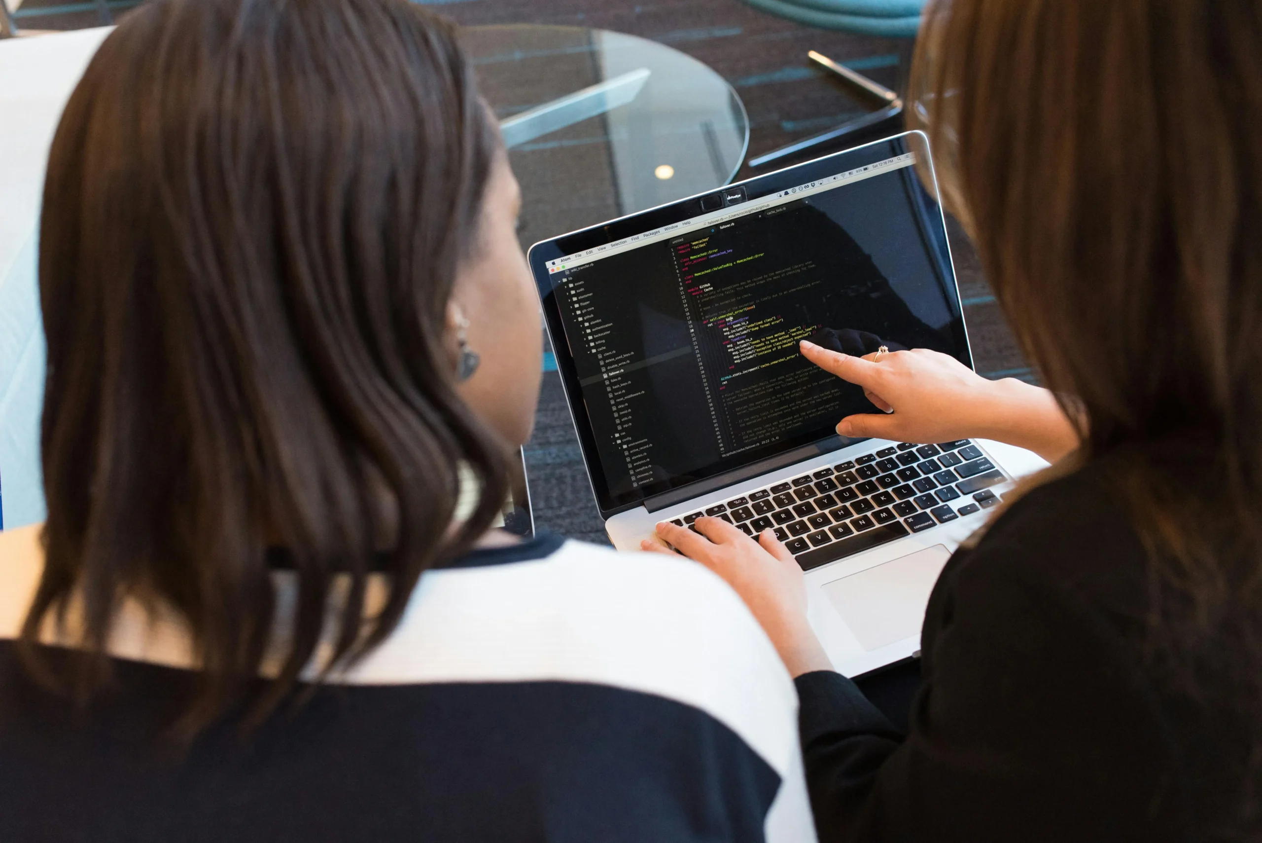 Professional woman developing ethics framework code and policies on laptop computer