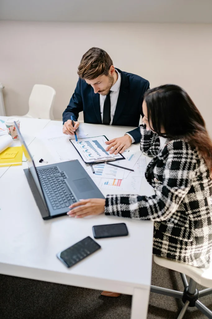 Business professionals reviewing project planning and scope definition in Canada.